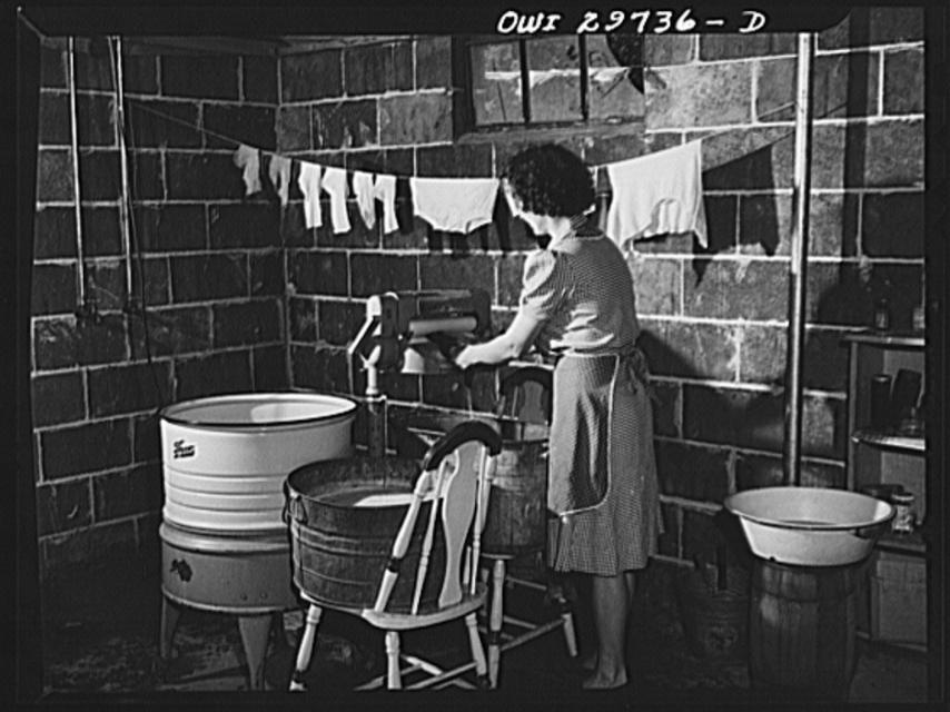 Point Pleasant, West Virginia. Mrs. Fergusen wringing out clothes