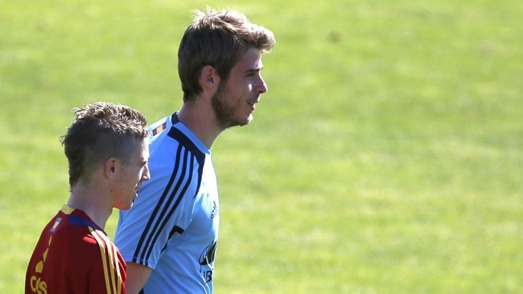 Muniain junto con De Gea.