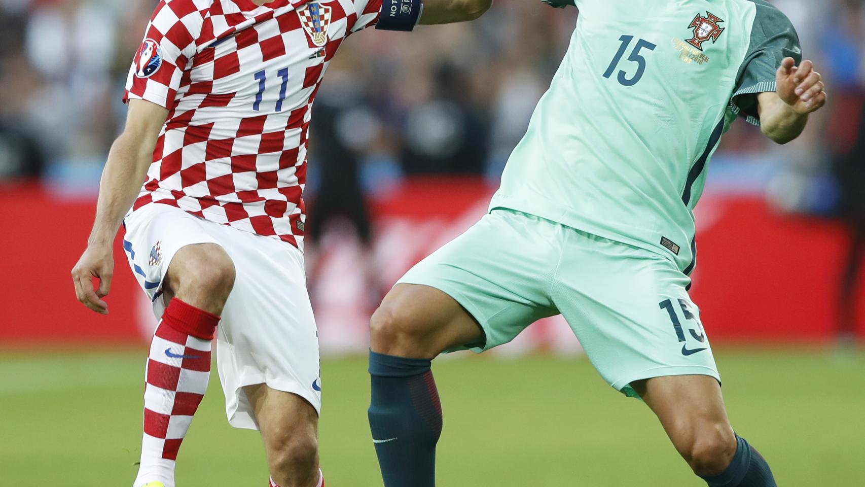 Croatia's Darijo Srna in action with Portugal's Andre Gomes