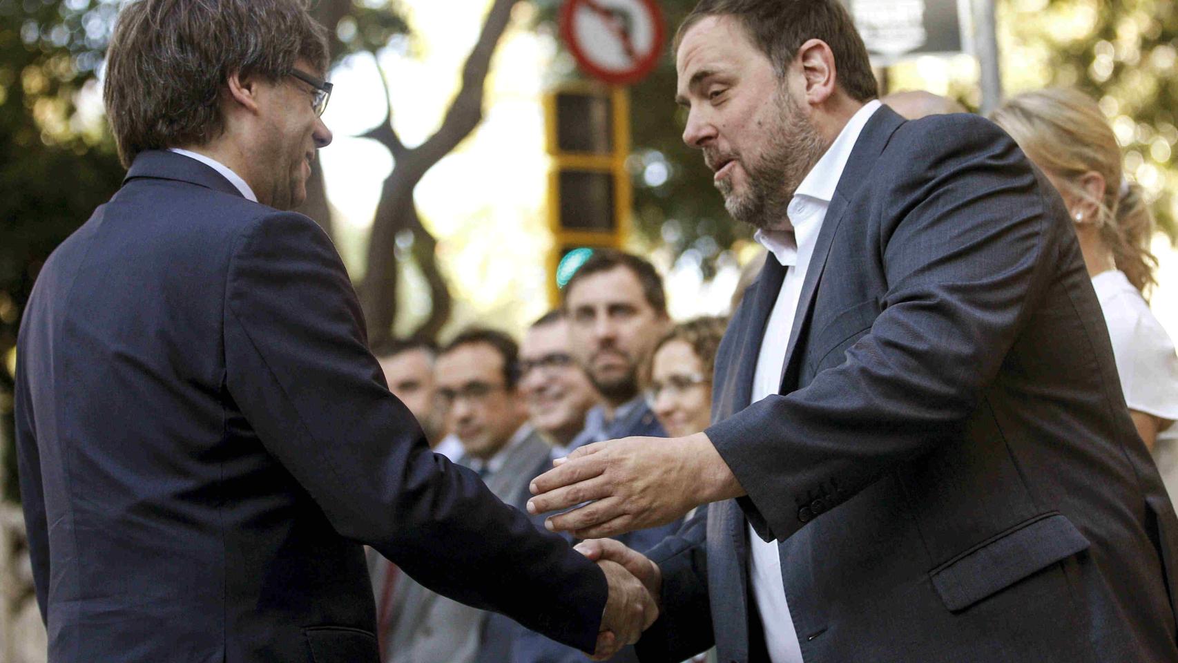 Carles Puigdemont y Oriol Junqueras.