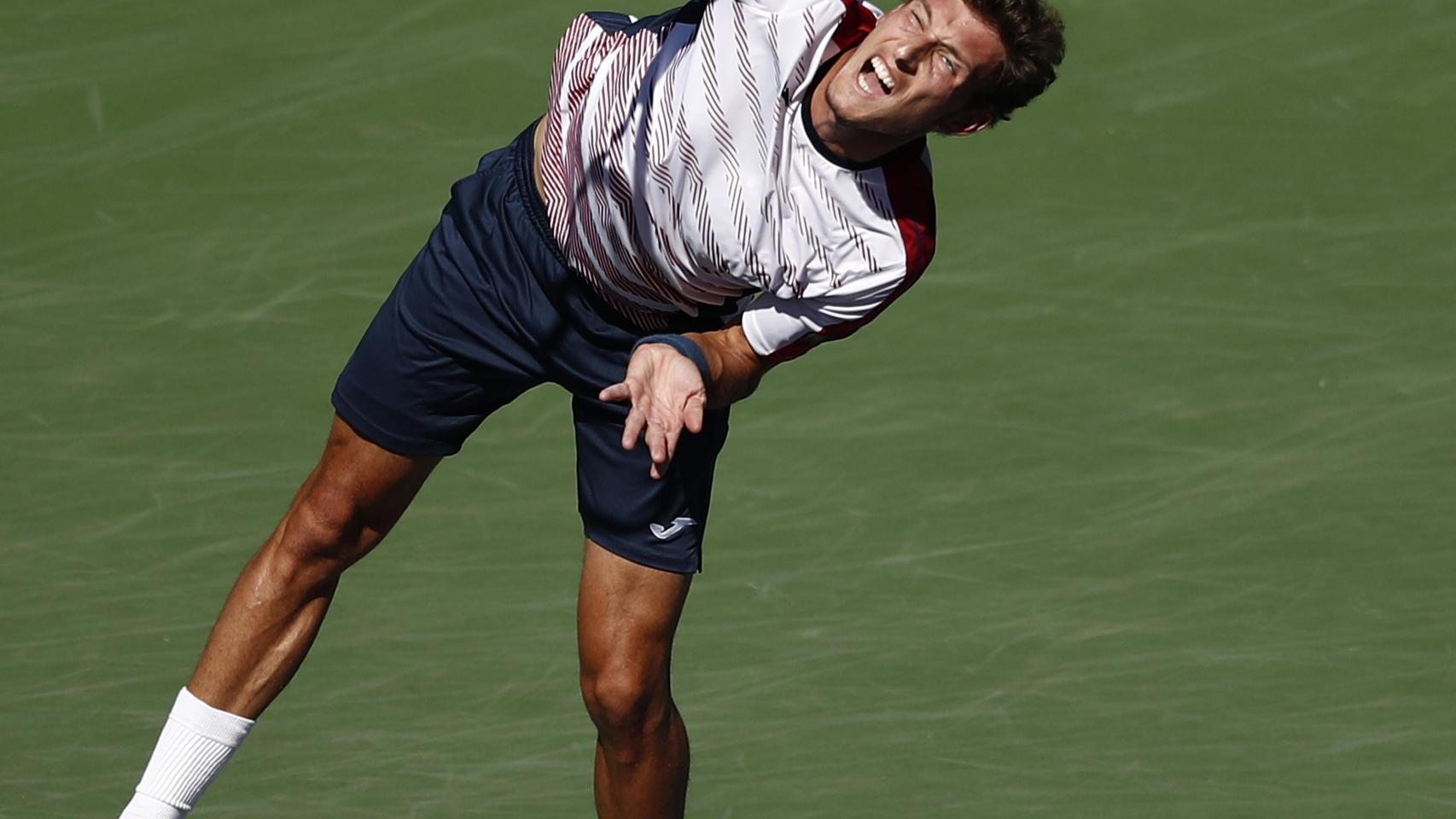 Pablo Carreño devuelve una bola contra Pablo Cuevas en cuartos de final.