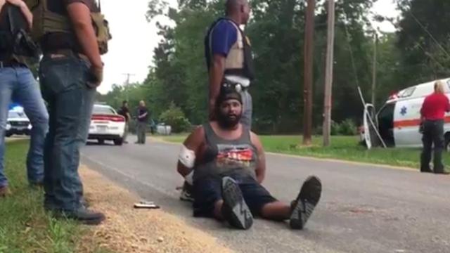 El sospechoso, detenido por la policía.