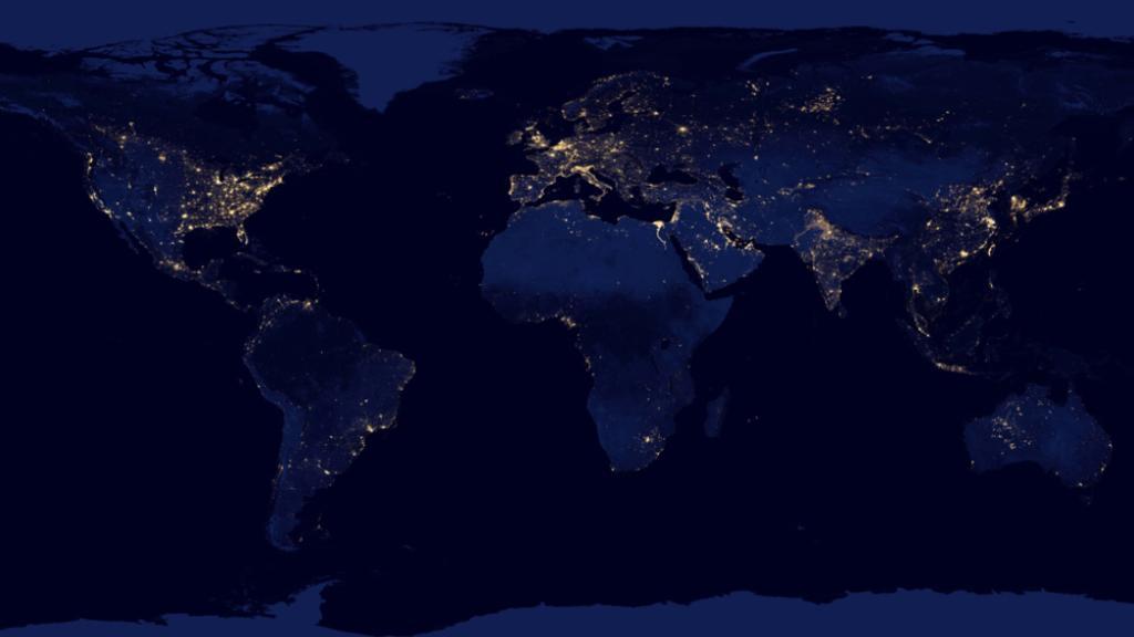 El mundo iluminado por luz eléctrica durante la noche.