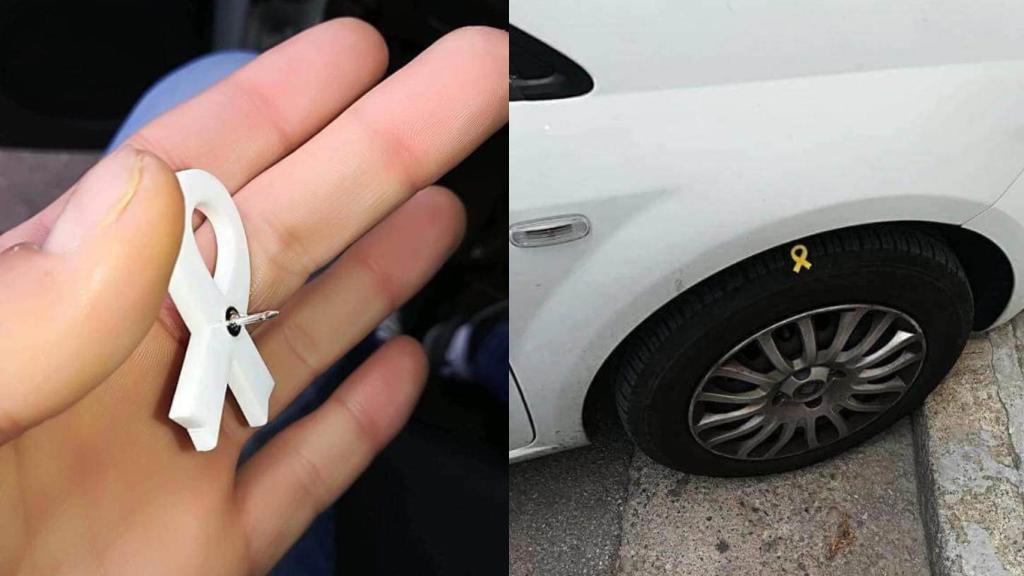 Pin de lazo amarillo pinchando una rueda