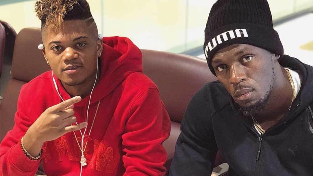 Leon Bailey junto a Usain Bolt.