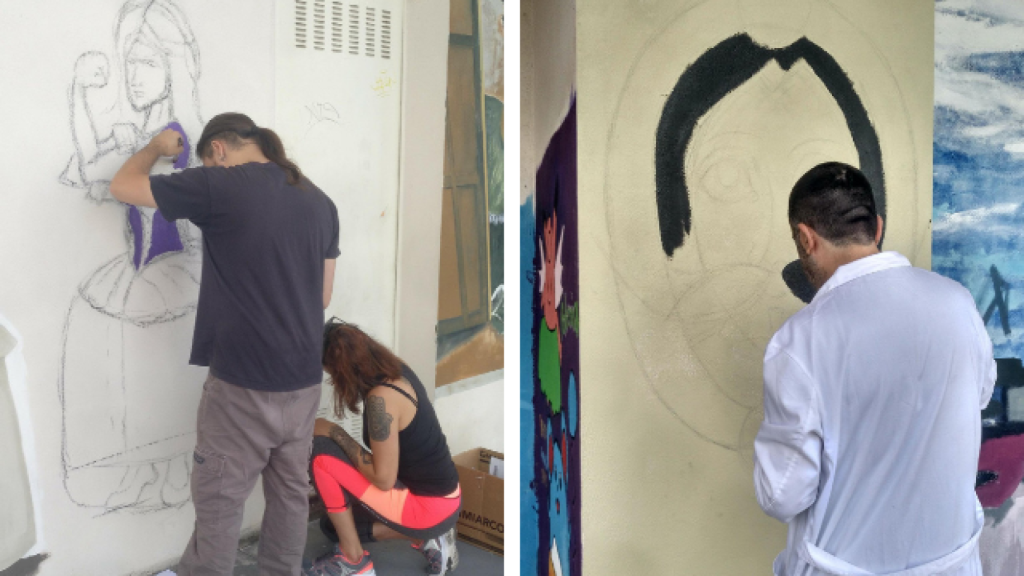 Artistas pintando las fachadas de Canido