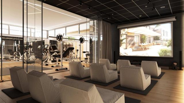 La sala de cine, junto al gimnasio, de la promoción Escalonia III de Aedas Homes en Las Rozas.
