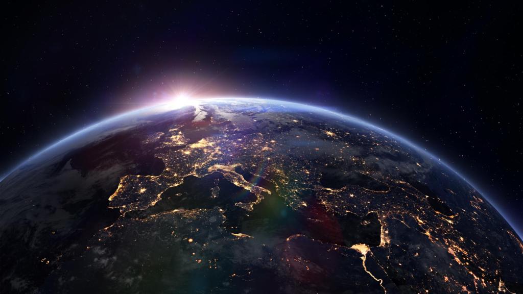 El Sol asoma ligeramente tras el planeta Tierra.