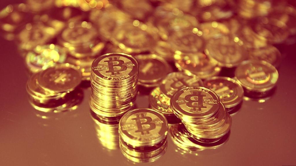 Varias monedas físicas representativas del bitcoin.