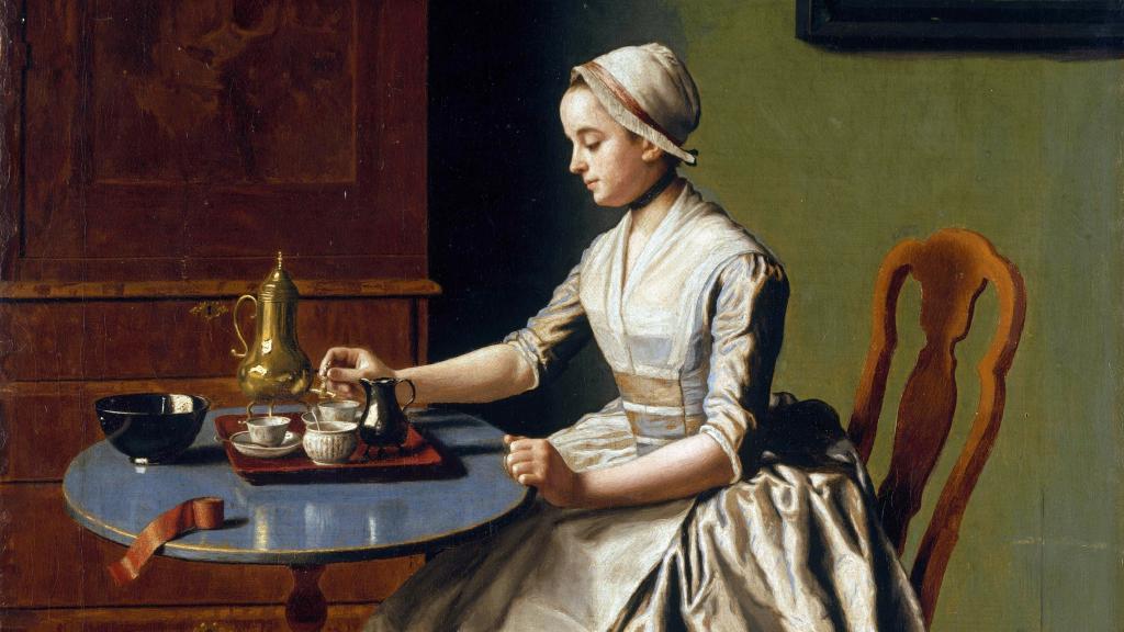 Retrato de una mujer tomando una taza de chocolate.