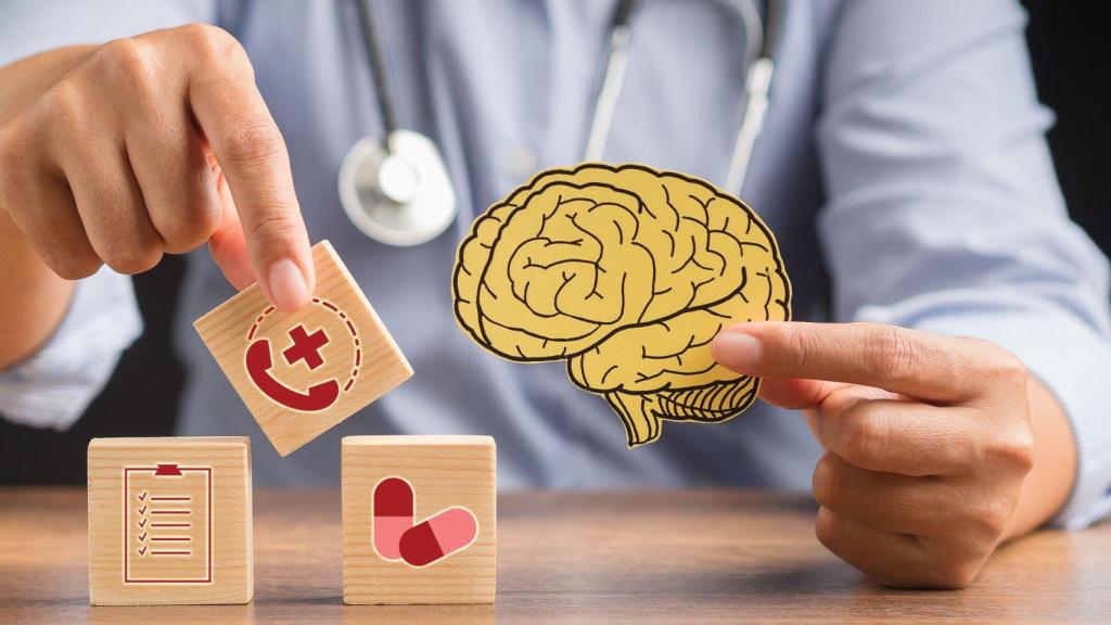 Doctor,Holding,A,Brain,Shape,Made,From,Yellow,Paper,And