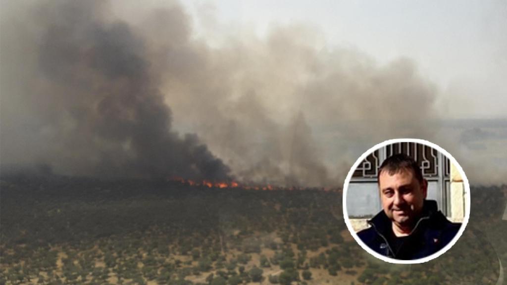 Enrique Seoane con el incendio de Castronuño al fondo