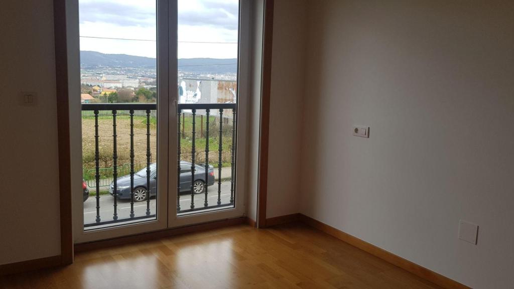 Dormitorio de una de las viviendas a la venta del 259 de la carretera de Catabois