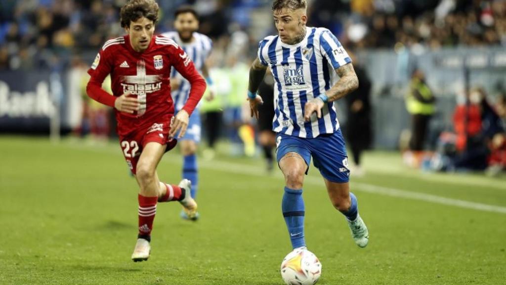 Delmás en un partido en La Rosaleda contra el Málaga CF