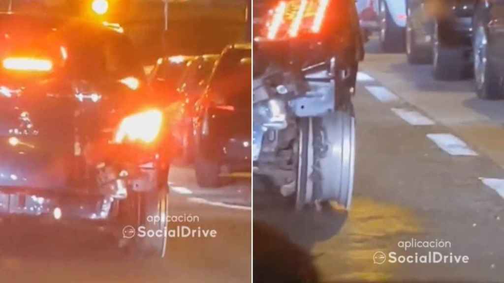 Un coche sin neumático circulando por Vigo.