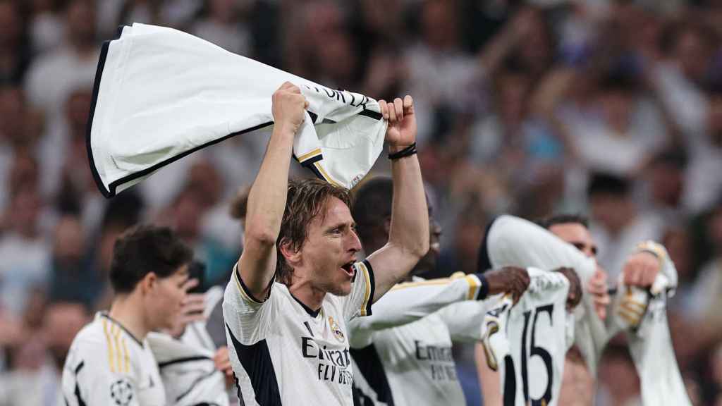 Modric celebra con el Real Madrid