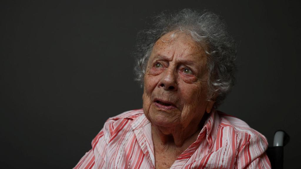 Teresa Regula, a 96-year-old Auschwitz-Birkenau survivor and retired sociologist, reacts during a photo shoot for Reuters ahead of the 80th anniversary of the liberation of the Nazi German concentration and extermination camp Auschwitz, in Krakow, Poland, in January 2025.