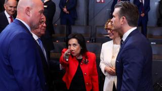 The Minister of Defense, Margarita Robles, between the US ambassador to NATO, Matthew Whitaker, and the Secretary of Defense, Pete Hegseth, during the meeting this Thursday in Brussels