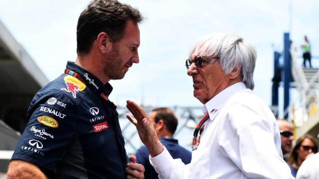 Bernie Ecclestone hablando con Christian Horner durante la celebración de un gran premio.