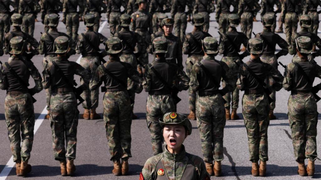 Training for a military parade commemorating the 80th anniversary of the end of World War II, in Beijing.