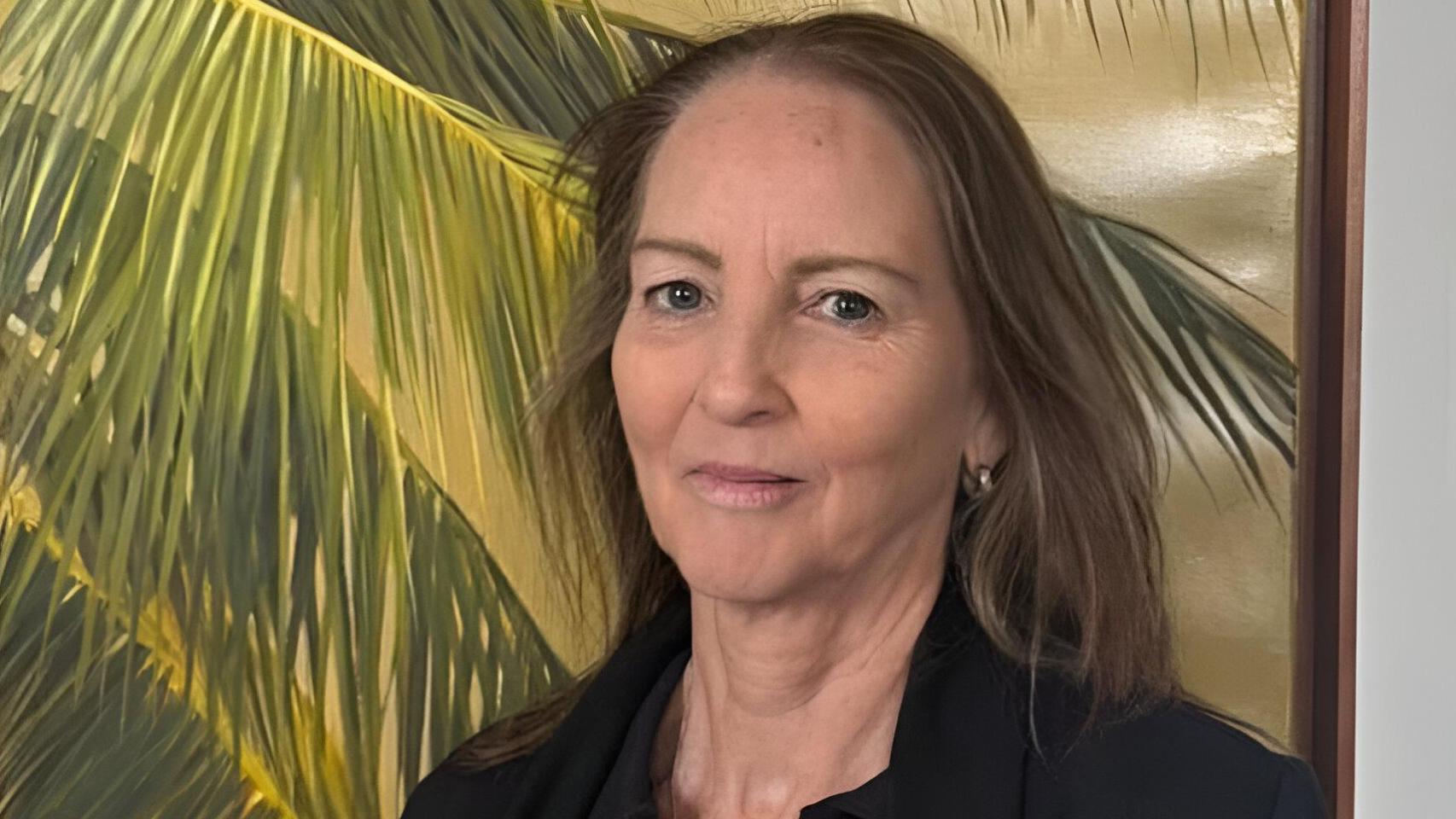 La cajera Kathryn Sullivan.