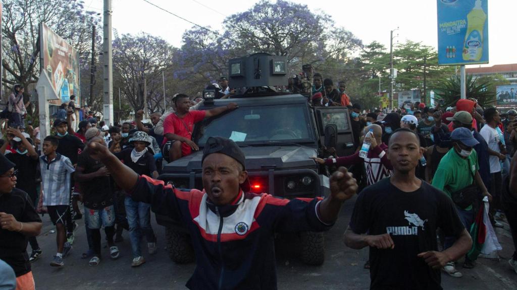 Protesters boarded an armored vehicle.