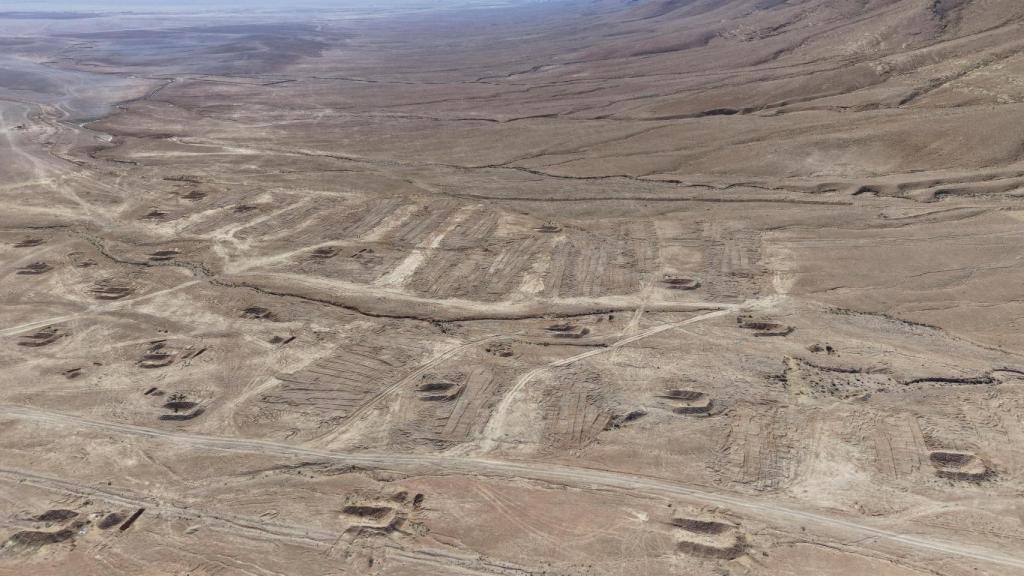 Aerial view of the mass grave in the Dhumair desert.