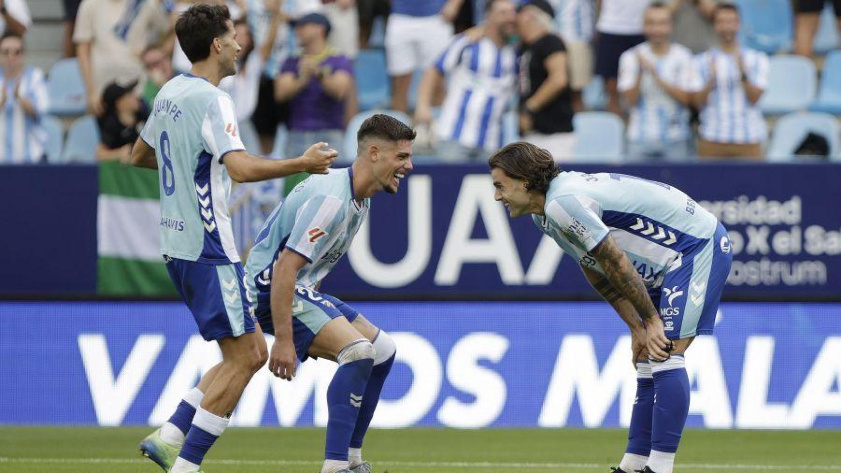 Jauregi y Montero celebra uno de los goles del Málaga contra el Andorra.
