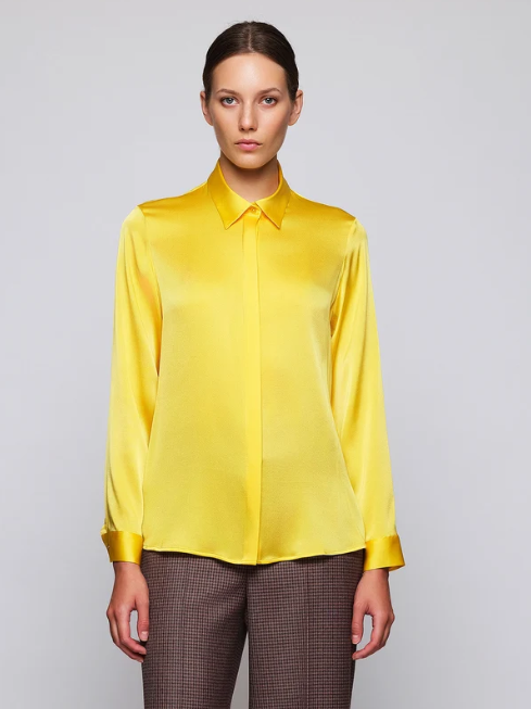 La blusa amarilla de Mirto para iluminar los looks de temporada que puede ser tuya